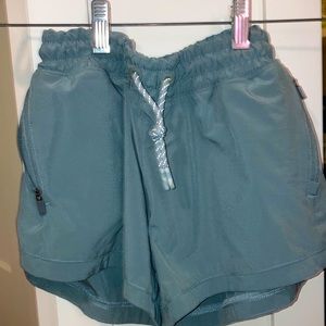 Green Athleta Shorts (girls L/12)